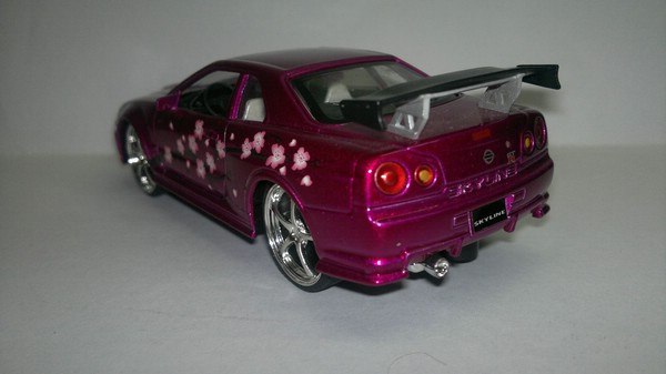 Nissan Skyline GTR 34 (Saico) [1999г., Розовый металлик, 1:32]